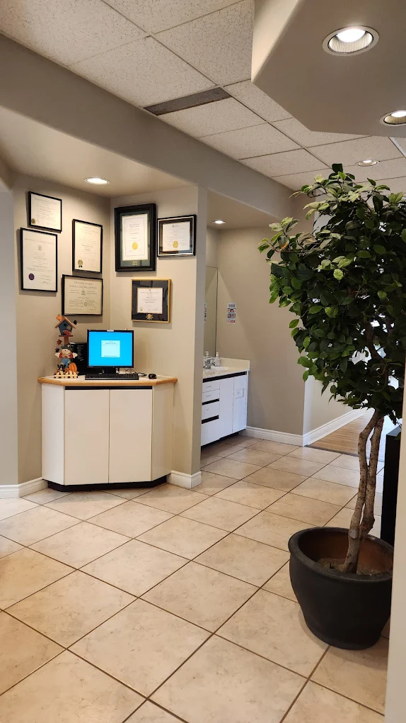 Waiting area with brown leather sofas and natural lighting